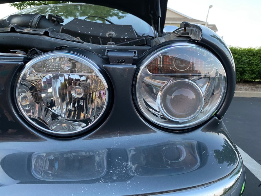 After Jaguar XJ8 headlight restoration — clear lens