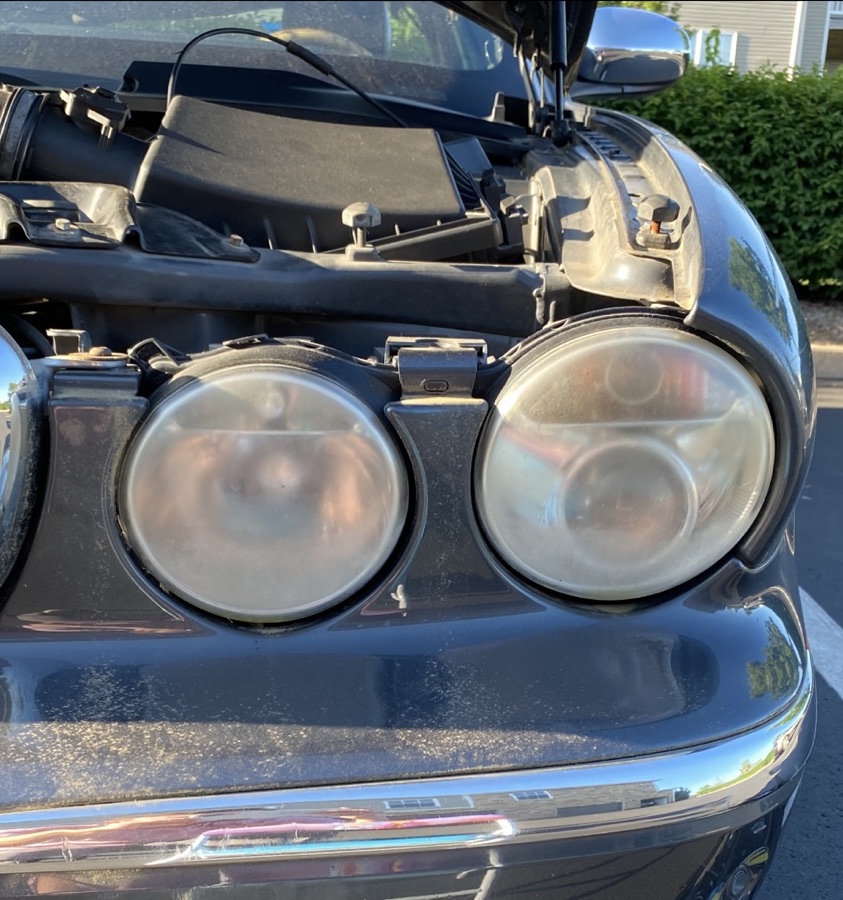 Before Jaguar XJ8 headlight restoration — foggy lens