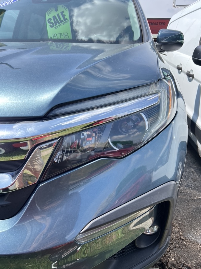After Honda Pilot headlight restoration — clear lens