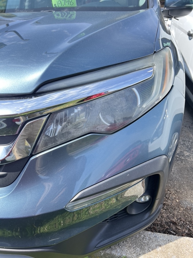 Before Honda Pilot headlight restoration — yellowed lens